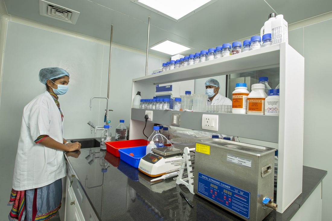 QC analyst working at the analytical bench in the quality control laboratory